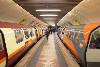 Interior. View looking along island platform of Kelvinhall subway station, with trains at both platforms