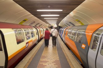 Interior. View looking along island platform of Kelvinhall subway station, with trains at both platforms