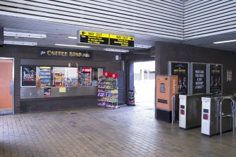 View looking back across the concourse of Cowcaddens subway station towards the entrances