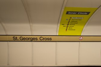 Detail of signage and network map on tunnel wall of St George’s Cross subway station