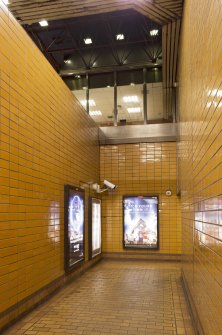 View looking into double-height stair hall, including concourse roof structure, from lower level of St George’s Cross subway station