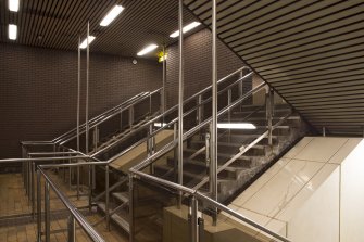 View looking across stairwell from half landing of stairs linking concourse and platform levels in Buchanan Street subway station