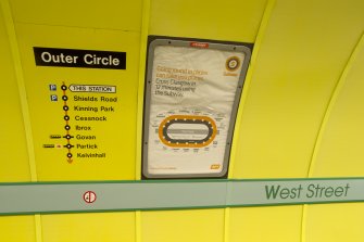  Detail view of signage and network maps on the tunnel wall of West Street subway station