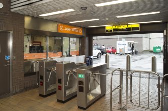 View of turnstiles, ticket office and main entrance of West Street subway station