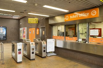 View of ticket office and turnstiles within the concourse of West Street subway station