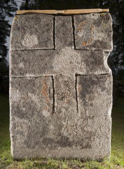 View of slab with incised outline cross (flash) with scale
