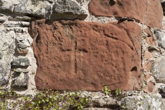 Detail of incised cross on interior east wall.