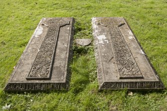 Detail of pair of gravestones with carved crosses.
