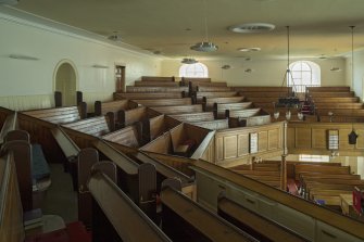 Interior. View looking across the pews of the gallery, taken from the west