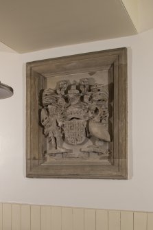 Interior. Detail of stone carved armorial panel with coat of arms