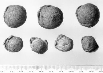 Lead musket bullets (top) and arquebus bullets (bottom) showing the characteristics of impact which suggest that they have been fired.