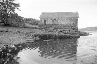 Achranich boathouse from the north. One branch of the river channel runs alongside the low-water quay