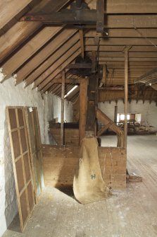 Interior. View of grain chutes at second floor level of mill.