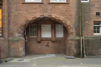 Exterior. Detail of arched opening with recessed window on the south elevation of the Spiers Centre.