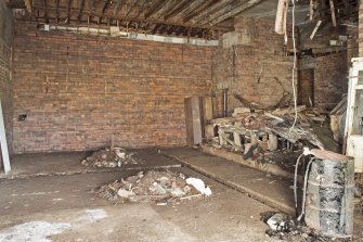 Interior. View of the remains of the operations room and dais, taken from the north west.