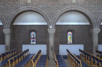 Interior. Two arched bays of north aisle, view from south