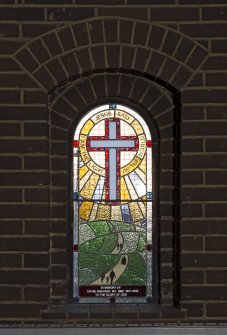 Interior. Detail of stained glass window in north aisle