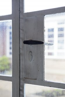 Interior. Corridor to south of courtyard, detail of door catch