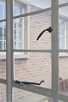 Interior. Corridor to south of courtyard, detail of window catches
