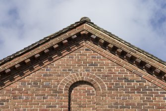 East facade, detail of apex of gable