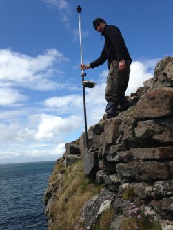 G Cavers (AOC) surveying the outer face of the inner wall.