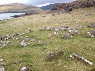 The largest of the huts visible outside the dun.