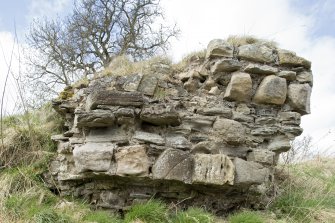 Isolated block of masonry from the Teviotside curtain wall of Roxburgh castle NE of the main length of wall, from the SE