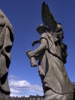 Detail of monumental statue of an angel at Rosebank Cemetery, Edinburgh.