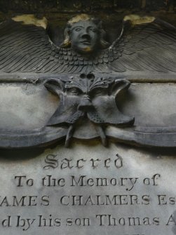 Detail of relief showing the head and wings of an angel, sacred to the memory of James Chalmers, in Greyfriar's Chuchyard,Edinburgh.