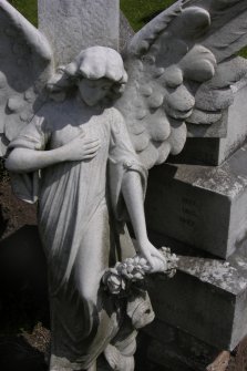 Detail of a statue of an angel holding a garland of flowers, Mount Vernon Cemetery, Edinburgh.