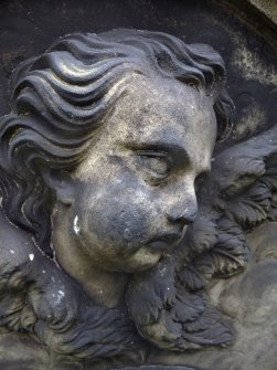 Detail of a relief showing the head of an angel, Old Calton Burial Ground, Edinburgh.