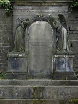 Detail of relief showing two angels surrounding a headstone, in memory of members of the Cooper family. Glasgow Necropolis.