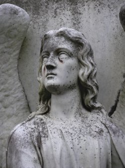 Image showing the head and shoulders of a statue of an angel, with graffiti on the face, Cathedral Graveyard, St. Andrews.