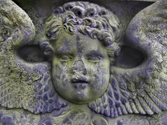 Detail of relief showing the face and wings of an angel, The Howff Burial Ground, Dundee.