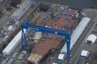 Oblique aerial view of the Goliath Crane and construction of aircraft carrier, looking to the SSE.