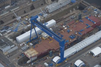 Oblique aerial view of the Goliath Crane and construction of aircraft carrier, looking to the SE.