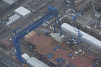 Oblique aerial view of the Goliath Crane and construction of aircraft carrier, looking to the NE.