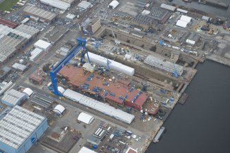 Oblique aerial view of the Goliath Crane and construction of aircraft carrier, looking to the E.