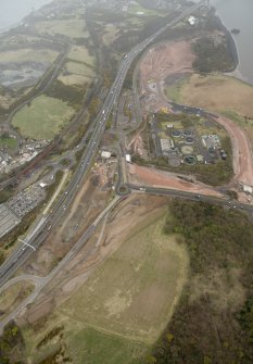 Oblique aerial view of the approach road to the new Forth Bridge Crossing under construction, looking to the SE.