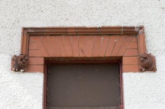 Bandstand, detail of brick pediment above window on east facade