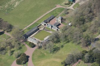 Oblique aerial view of Hardington House Stable Range, looking to the W.