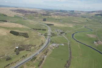 General oblique aerial view of the Upper Clyde Valley with Abington Motorway Service Station in the foreground, looking to the NE.
