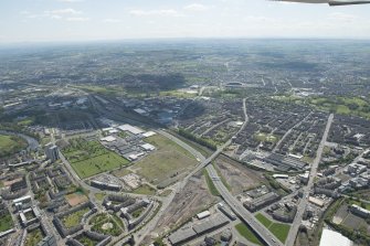 General oblique aerial view of Glasgow centred on the M74 extension at Rutherglen, looking to the SW.