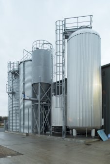 Ellon, Brewdog craft brewery. View of barley silos (left), spent grost tank, spent yeast tank and water tank (right) which supplies the reservoir for brewing.
