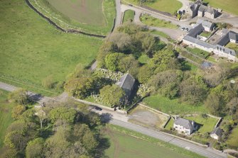 Oblique aerial view of Foveran Parish Church and Manse, looking to the WNW.