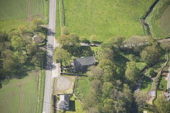 Oblique aerial view of Foveran Parish Church and Manse, looking to the S.