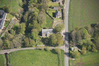 Oblique aerial view of Foveran Parish Church and Manse, looking to the N.