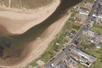 Oblique aerial view of anti tank blocks, Port Erroll, looking to the NW.