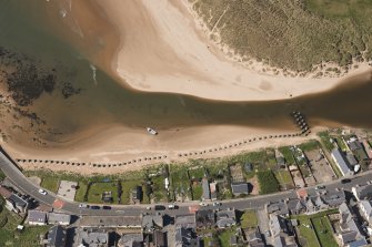 Oblique aerial view of anti tank blocks, Port Erroll, looking to the W.