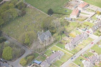 Oblique aerial view of New Pitsligo Parish Church, looking to the NW.